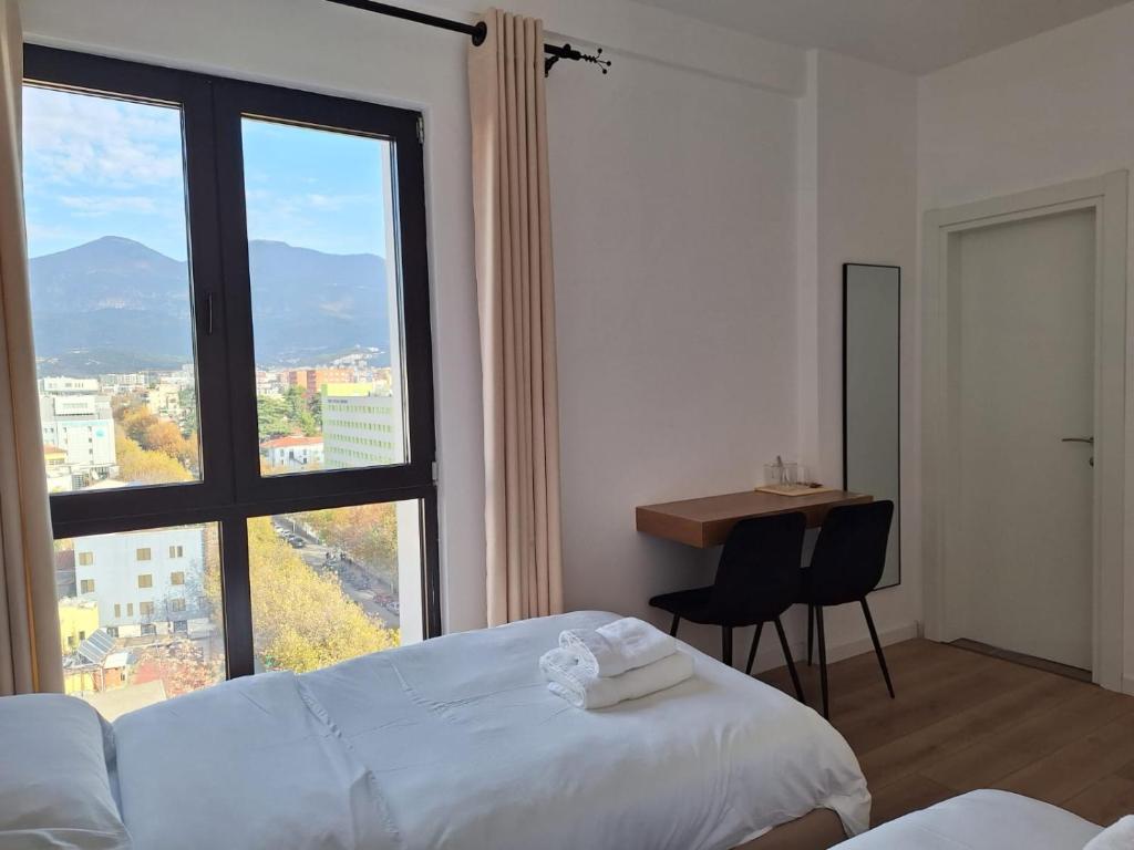 Bedroom with panoramic mountain views over Tirana