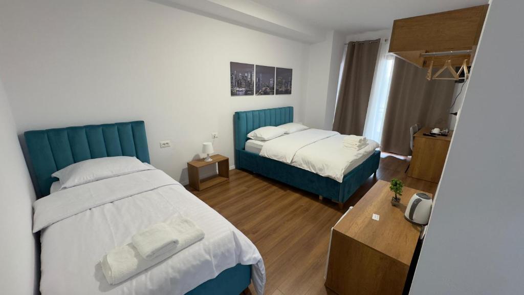 Comfortable twin bedroom with modern artwork