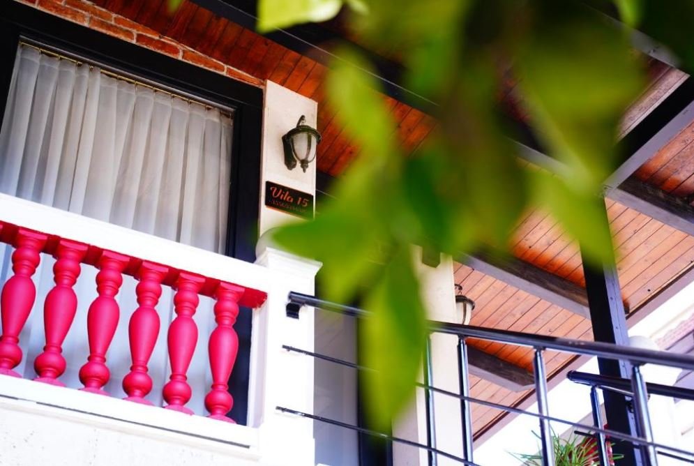 The balcony at Vila 15 with its pink railing